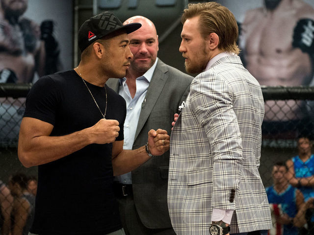 LAS VEGAS, NV - AUGUST 26: (R-L) UFC interim featherweight champion Conor McGregor and UFC featherweight Champion Jose Aldo face off during the filming of The Ultimate Fighter: Team McGregor vs Team Faber at the UFC TUF Gym on August 26, 2015 in Las Vegas, Nevada.