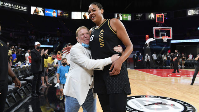 LAS VEGAS, NV - AUGUST 15: Liz Cambage #8 of the Las Vegas Aces Aces hugs owner, Mark Davis of the Las Vegas Aces after the game against the Washington Mystics on August 15, 2021 at Michelob ULTRA Arena in Las Vegas, Nevada. Mandatory Copyright Notice: Copyright 2021 NBAE
