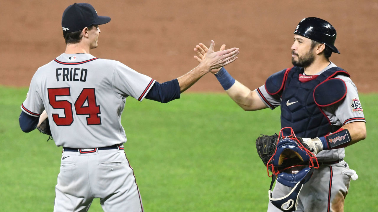BALTIMORE, MD - AUGUST 20: Max Fried #54 of the Atlanta Braves celebrates with Travis d'Arnaud #16 after the baseball game against the Baltimore Orioles at Oriole Park at Camden Yards on August 20, 2021 in Baltimore, Maryland. The Braves defeated the Orioles 3-0.