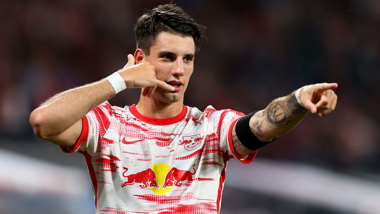 LEIPZIG, GERMANY - AUGUST 20: Dominik Szoboszlai of RB Leipzig celebrates after he scores the opening goal during the Bundesliga match between RB Leipzig and VfB Stuttgart at Red Bull Arena on August 20, 2021 in Leipzig, Germany.