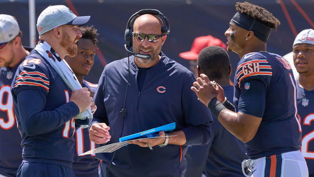 CHICAGO, IL - AUGUST 14: Chicago Bears quarterback Justin Fields (1) chats with quarterback Andy Dalton (14) and head coach Matt Nagy during a preseason game between the Chicago Bears and the Miami Dolphins on August 14, 2021 at Soldier Field in Chicago, IL.