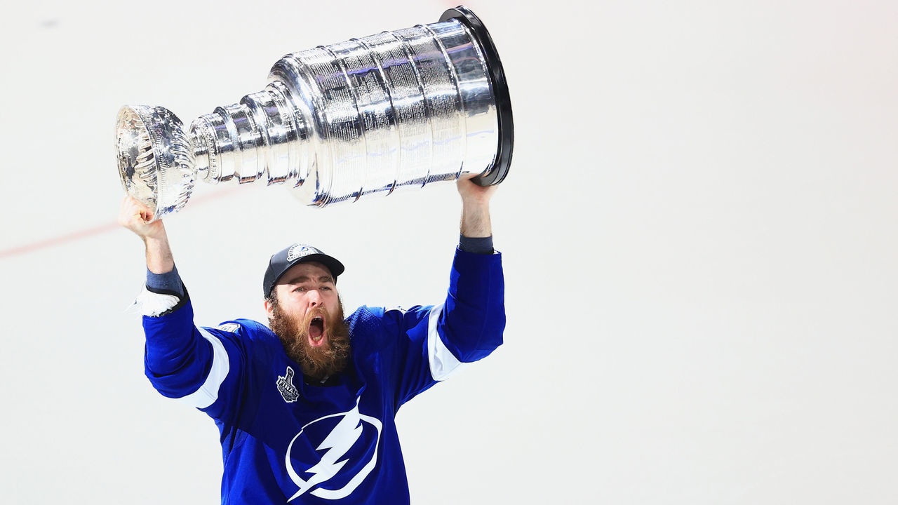 TAMPA, FLORIDA - JULY 07: David Savard #58 of the Tampa Bay Lightning skates with the Stanley Cup following the team's victory over the Montreal Canadiens in Game Five of the 2021 NHL Stanley Cup Final at the Amalie Arena on July 07, 2021 in Tampa, Florida. The Lightning defeated the Canadiens 1-0 to take the series four games to one.
