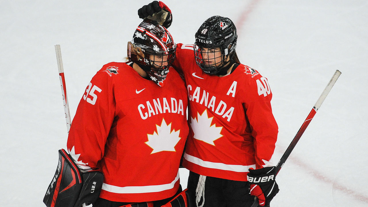 CALGARY, AB - AUGUST 20: Ann-Renee Desbiens #35 (L) and Blayre Turnbull #40 of Canada celebrate after defeating Finland in the 2021 IIHF Women's World Championship Group A match played at WinSport Arena on August 20, 2021 in Calgary, Canada.