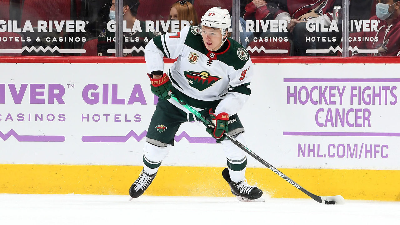GLENDALE, ARIZONA - APRIL 19: Kirill Kaprizov #97 of the Minnesota Wild skates the puck up ice against the Arizona Coyotes at Gila River Arena on April 19, 2021 in Glendale, Arizona.