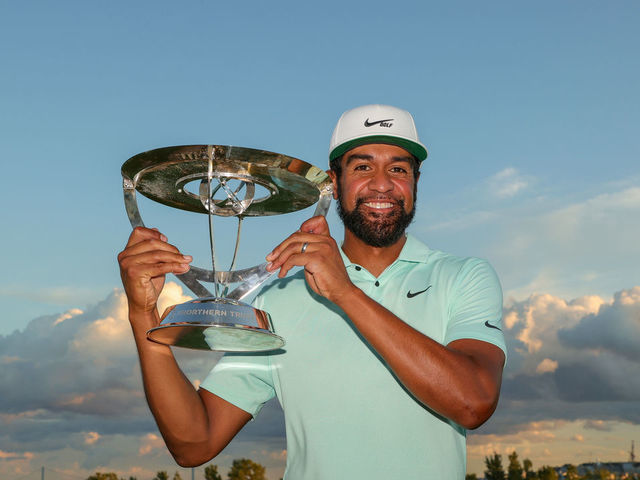 JERSEY CITY, NEW JERSEY - AUGUST 23: Tony Finau of the United States celebrates with the trophy after winning in a playoff during the final round of THE NORTHERN TRUST, the first event of the FedExCup Playoffs, at Liberty National Golf Club on August 23, 2021 in Jersey City, New Jersey.