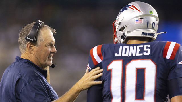 PHILADELPHIA, PA - AUGUST 19: Head coach Bill Belichick of the New England Patriots talks to Mac Jones #10 against the Philadelphia Eagles in the first half of the preseason game at Lincoln Financial Field on August 19, 2021 in Philadelphia, Pennsylvania. The Patriots defeated the Eagles 35-0.