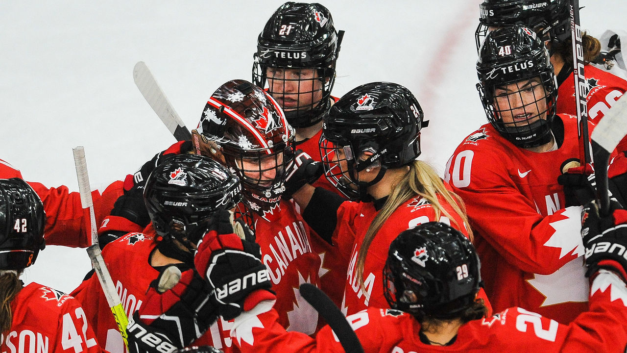 CALGARY, AB - AUGUST 20: Team Canada celebrates after defeating Finland in the 2021 IIHF Women's World Championship Group A match played at WinSport Arena on August 20, 2021 in Calgary, Canada.