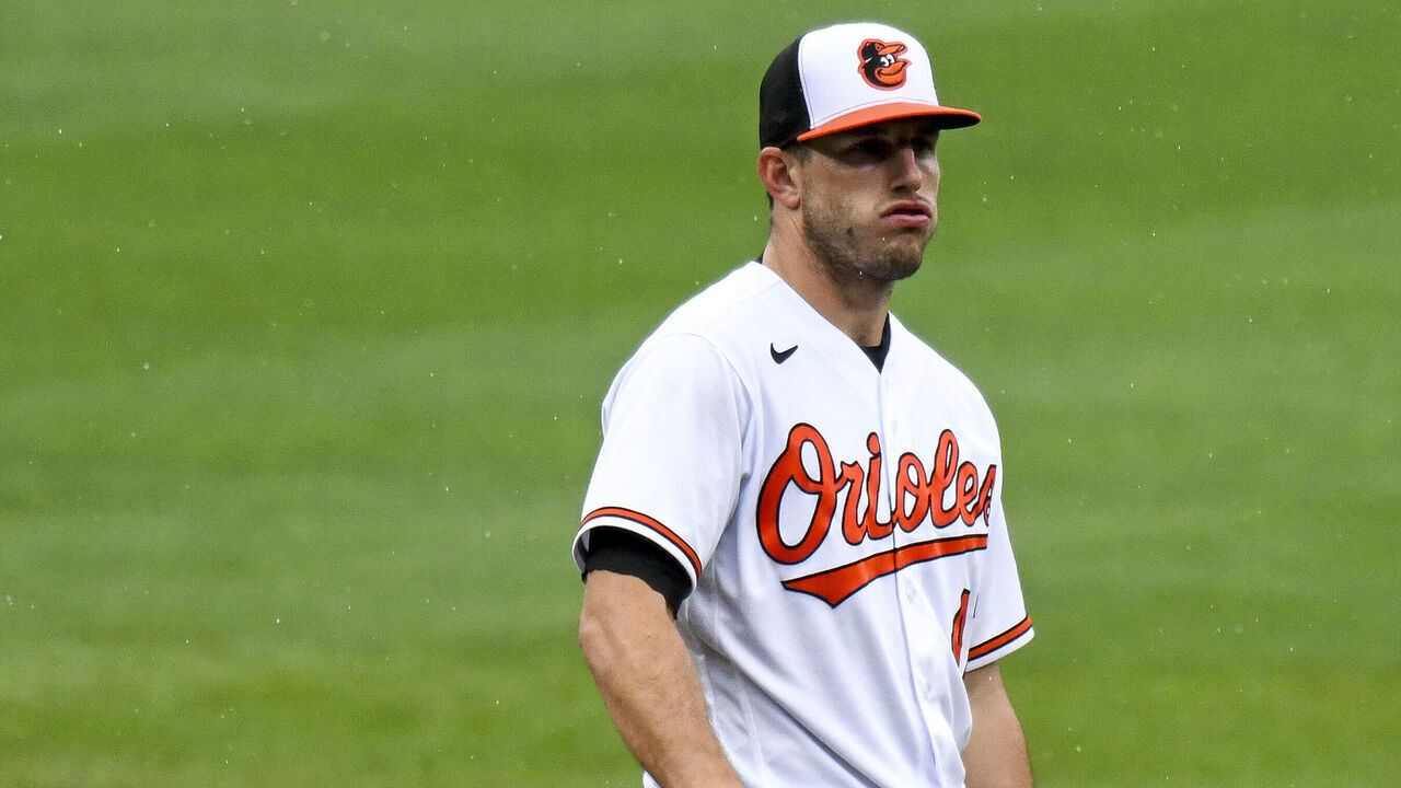 BALTIMORE, MD - AUGUST 22 Baltimore Orioles starting pitcher John Means (47) reacts as the manager comes out to relieve him during the Atlanta Braves game versus the Baltimore Orioles on August 22, 2021 at Orioles Park at Camden Yards, in Baltimore, MD.