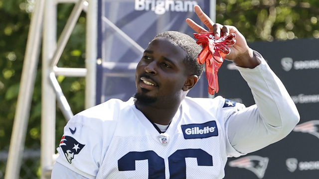 FOXBOROUGH, MA - JULY 30: New England Patriots running back Sony Michel (26) waves during New England Patriots training camp on July 30, 2021 at Gillette Stadium in Foxborough, Massachusetts.