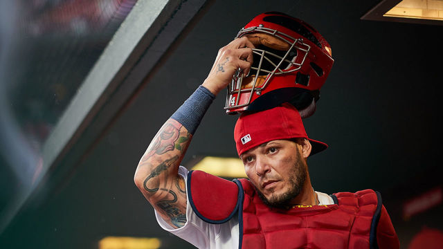 ST. LOUIS, MO - APRIL 24: Yadier Molina #4 of the St. Louis Cardinals puts his catchers mask on as he prepares to leave the dugout during a game against the Milwaukee Brewers on April 4, 2019 at Busch Stadium in St. Louis, Missouri.