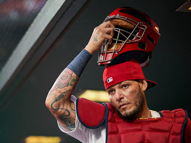 ST. LOUIS, MO - APRIL 24: Yadier Molina #4 of the St. Louis Cardinals puts his catchers mask on as he prepares to leave the dugout during a game against the Milwaukee Brewers on April 4, 2019 at Busch Stadium in St. Louis, Missouri.