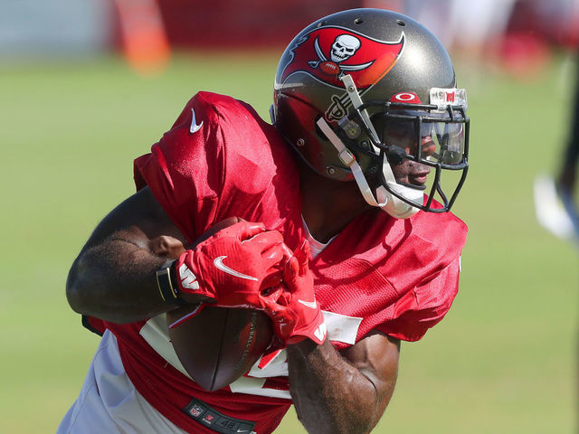TAMPA, FL - AUG 19: Giovani Bernard (25) of the Buccaneers carries the ball during the Tennessee Titans & Tampa Bay Buccaneers joint training camp on August 19, 2021 at the AdventHealth Training Center at One Buccaneer Place in Tampa, Florida.