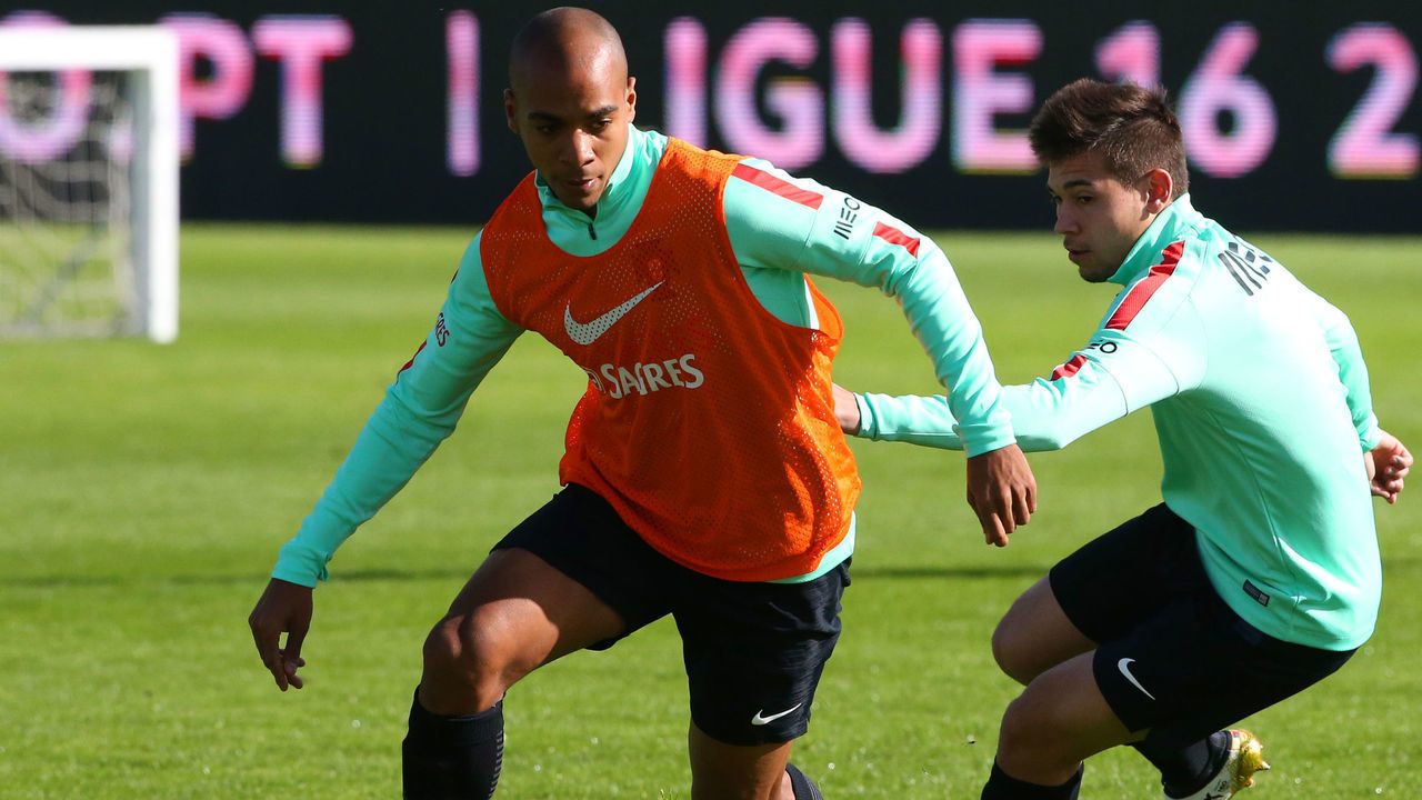 OEIRAS, PORTUGAL - NOVEMBER 10: PortugalÕs midfielder Joao Mario (L) with PortugalÕs defender Raphael Guerreiro (R) in action during Portugal's National Team Training session before the 2018 FIFA World Cup Qualifiers matches against Latvia at FPF Cidade do Futebol on November 10, 2016 in Oeiras (outskirts of Lisbon), Portugal.