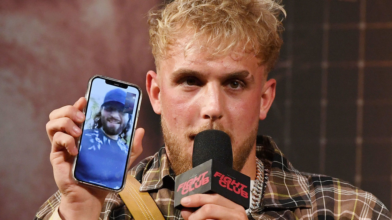 LAS VEGAS, NEVADA - MARCH 26: Jake Paul talks to mixed martial artist Jorge Masvidal on his cell phone during a news conference for Triller Fight Club's inaugural 2021 boxing event at The Venetian Las Vegas on March 26, 2021 in Las Vegas, Nevada. Paul will face Ben Askren, who was knocked out by Masvidal in UFC 239 in 2019, in the main event that will take place on April 17, 2021, at Mercedes-Benz Stadium in Atlanta.