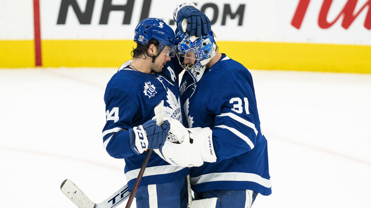 TORONTO, ON - FEBRUARY 4: Auston Matthews #34 and Frederik Andersen #31 of the Toronto Maple Leafs celebrate after defeating the Vancouver Canucks at the Scotiabank Arena on February 4, 2021 in Toronto, Ontario, Canada.