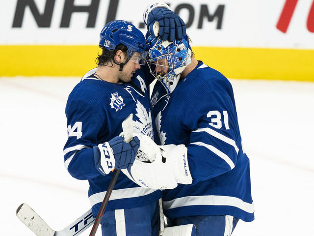 TORONTO, ON - FEBRUARY 4: Auston Matthews #34 and Frederik Andersen #31 of the Toronto Maple Leafs celebrate after defeating the Vancouver Canucks at the Scotiabank Arena on February 4, 2021 in Toronto, Ontario, Canada.