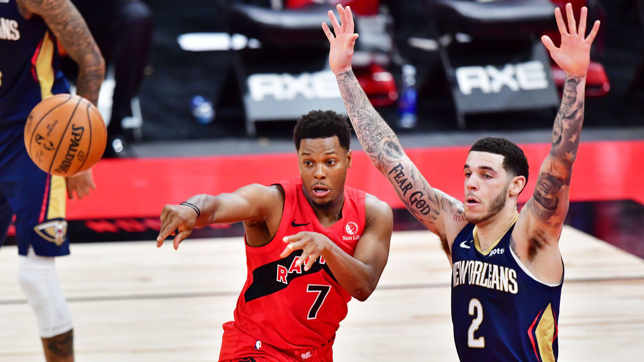 TAMPA, FLORIDA - DECEMBER 23: Kyle Lowry #7 of the Toronto Raptors passes the ball against Lonzo Ball #2 of the New Orleans Pelicans during the second half at Amalie Arena on December 23, 2020 in Tampa, Florida.