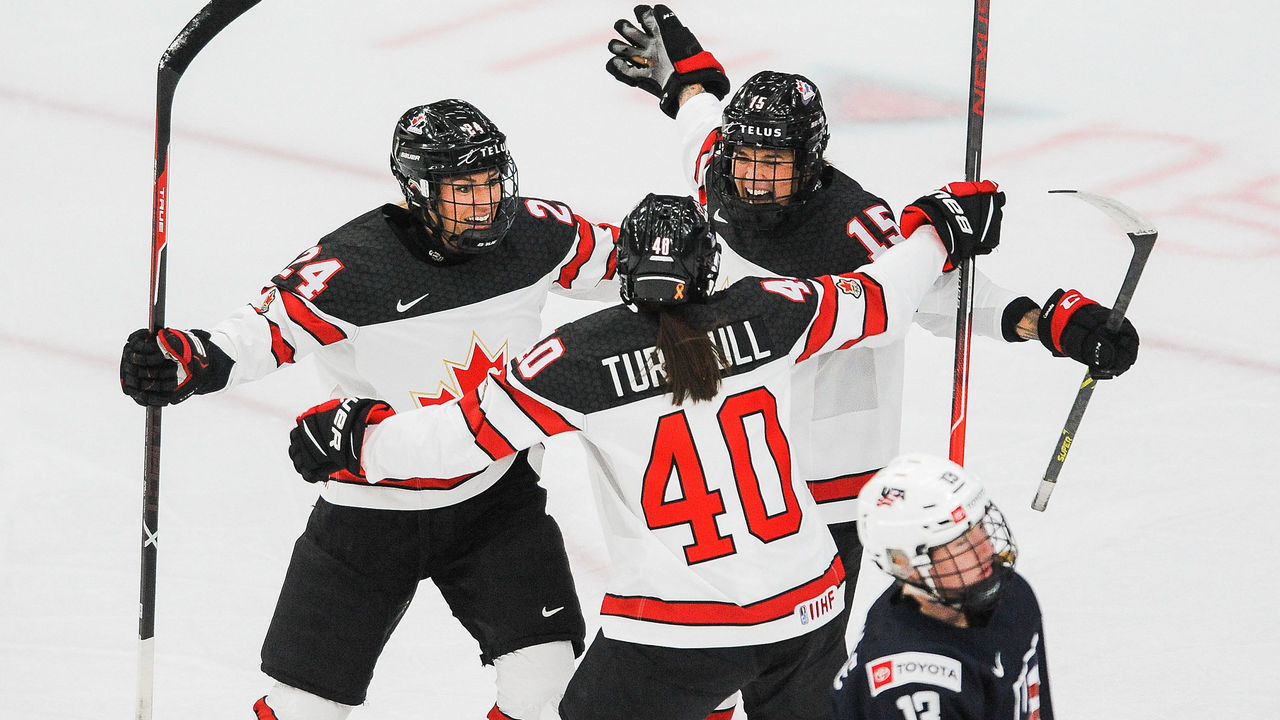 CALGARY, AB - AUGUST 26: Melodie Daoust #15 of Canada celebrates with her teammates after scoring her team's first goal against United States in the 2021 IIHF Women's World Championship Group A match played at WinSport Arena on August 26, 2021 in Calgary, Canada.
