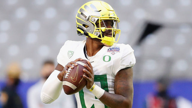 GLENDALE, ARIZONA - JANUARY 02: Quarterback Anthony Brown #13 of the Oregon Ducks drops back to pass during the second half of the PlayStation Fiesta Bowl against the Iowa State Cyclones at State Farm Stadium on January 02, 2021 in Glendale, Arizona. The Cyclones defeated the Ducks 34-17.