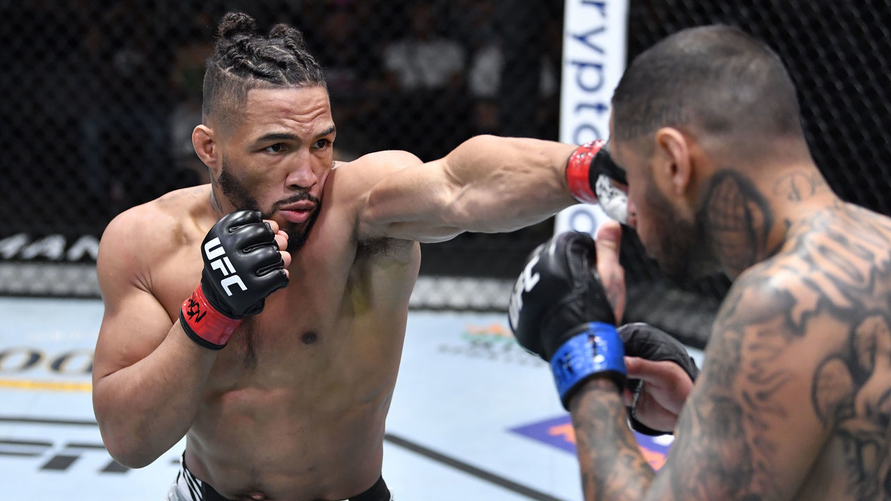 LAS VEGAS, NEVADA - AUGUST 28: (L-R) Kevin Lee punches Daniel Rodriguez in a welterweight fight during the UFC Fight Night event at UFC APEX on August 28, 2021 in Las Vegas, Nevada.