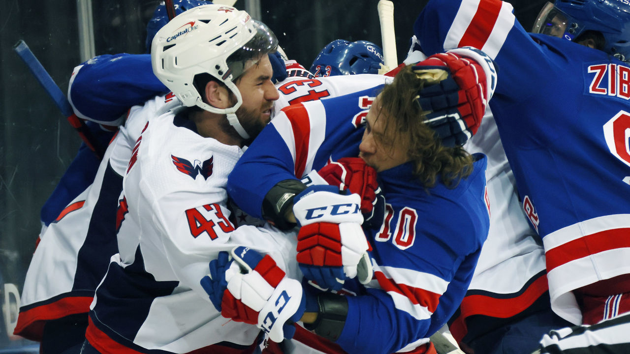 NEW YORK, NEW YORK - MAY 03: Tom Wilson #43 of the Washington Capitals takes a roughing penalty during the second period against Artemi Panarin #10 of the New York Rangers at Madison Square Garden on May 03, 2021 in New York City.