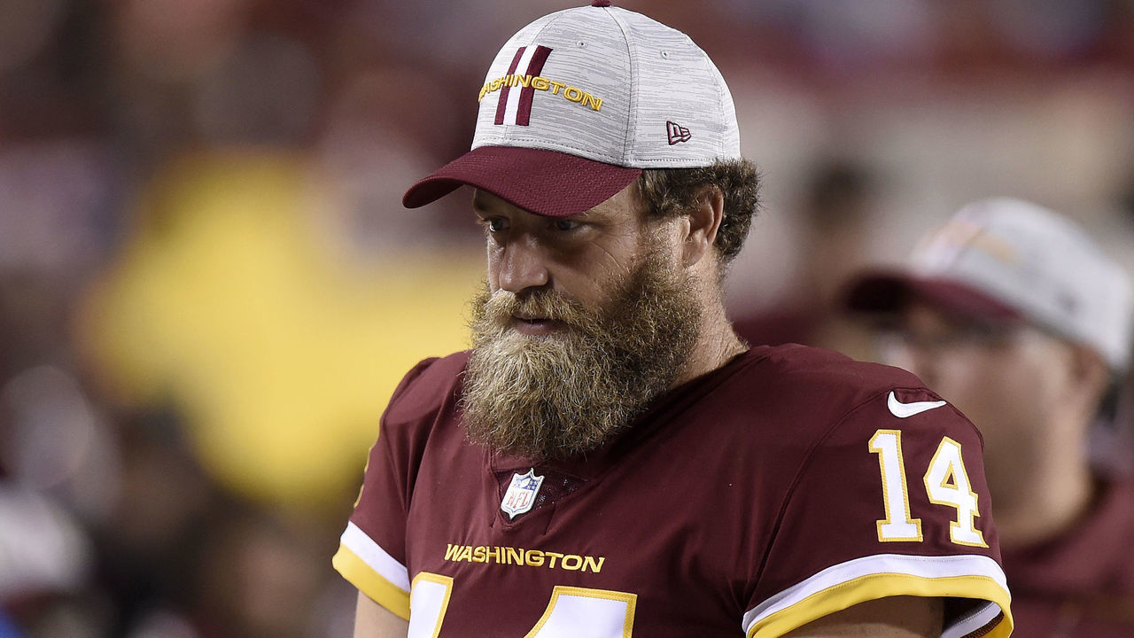 LANDOVER, MARYLAND - AUGUST 20: Ryan Fitzpatrick #14 of the Washington Football Team watches during the NFL preseason game against the Cincinnati Bengals at FedExField on August 20, 2021 in Landover, Maryland.