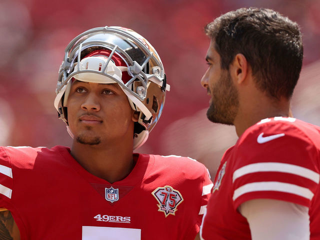 SANTA CLARA, CALIFORNIA - AUGUST 29: Jimmy Garoppolo #10 and Trey Lance #5 of the San Francisco 49ers talk to each other on the sidelines before their preseason game against the Las Vegas Raiders at Levi's Stadium on August 29, 2021 in Santa Clara, California.