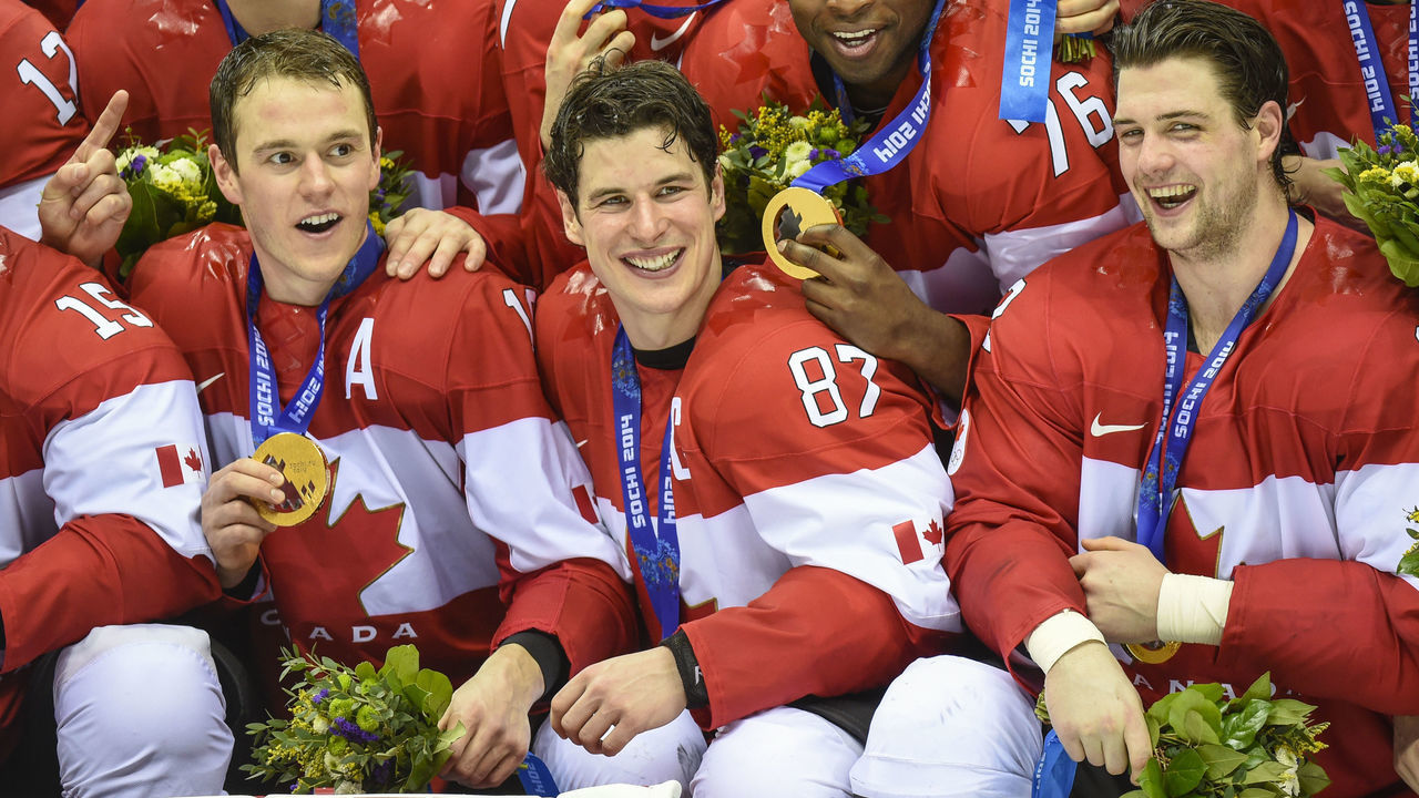 Sidney Crosby and Team Canada celebrate their gold medal after their 3-0 win over Sweden in the Sochi 2014 Winter Olympic Games: Men's hockey, Gold medal final.