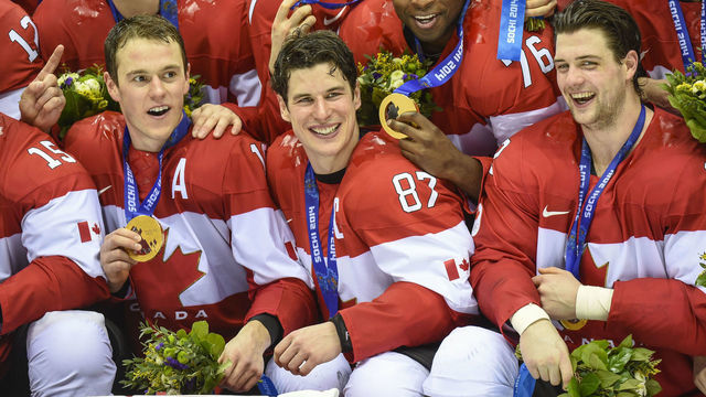 Sidney Crosby and Team Canada celebrate their gold medal after their 3-0 win over Sweden in the Sochi 2014 Winter Olympic Games: Men's hockey, Gold medal final.