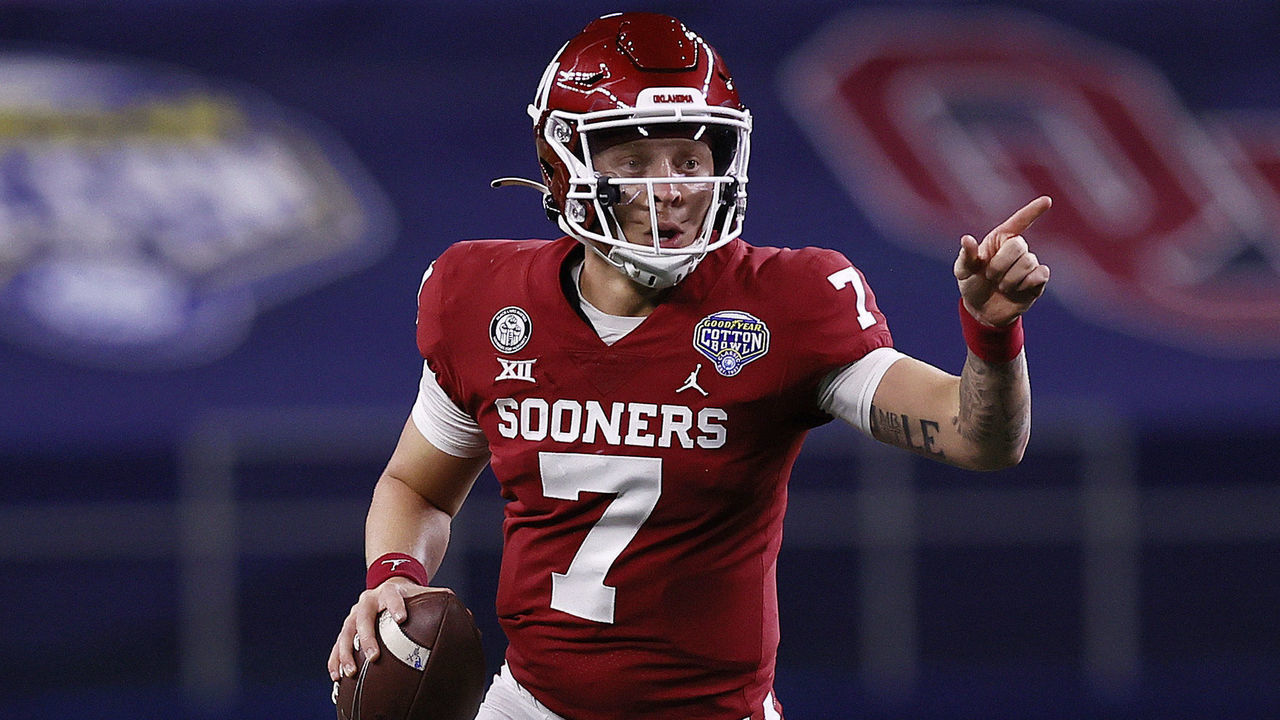 ARLINGTON, TEXAS - DECEMBER 30: Quarterback Spencer Rattler #7 of the Oklahoma Sooners scrambles against the Florida Gators during the second quarter at AT&T Stadium on December 30, 2020 in Arlington, Texas.
