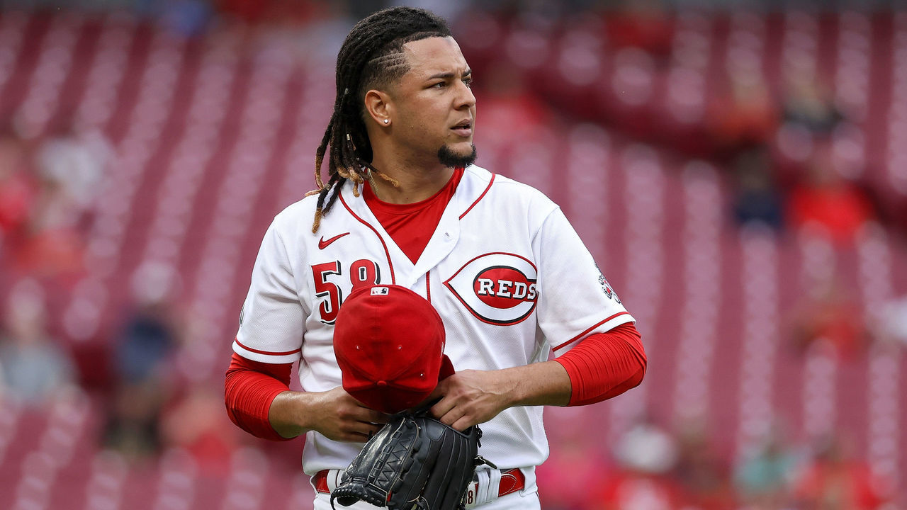 CINCINNATI, OHIO - AUGUST 30: Luis Castillo #58 of the Cincinnati Reds walks across the field in the first inning against the St. Louis Cardinals at Great American Ball Park on August 30, 2021 in Cincinnati, Ohio.