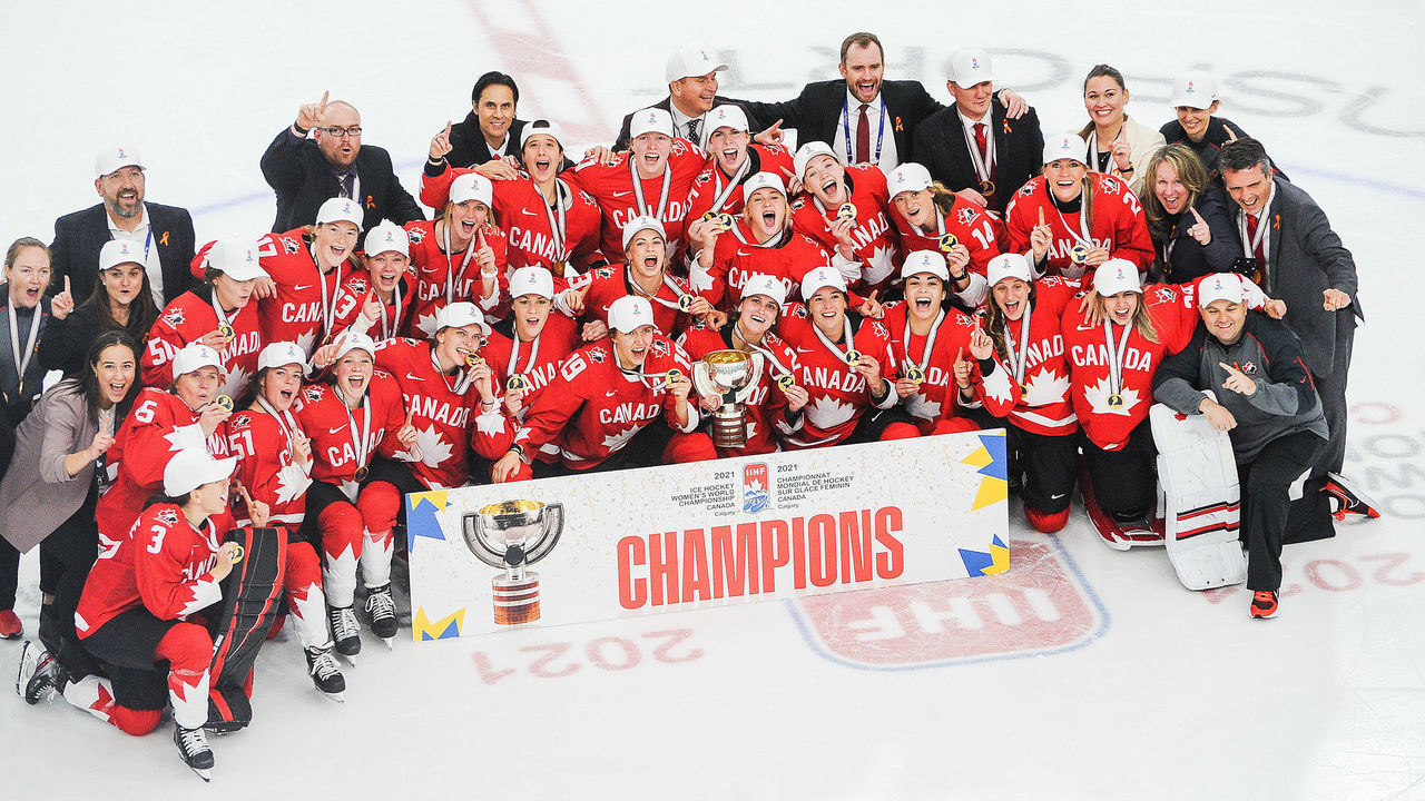 CALGARY, AB - AUGUST 31: Team Canada poses for a team photo with the championship trophy after their victory over United Sates in the 2021 IIHF Women's World Championship gold medal game played at WinSport Arena on August 31, 2021 in Calgary, Canada.
