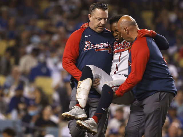 Braves star Albies carried away after fouling ball off knee