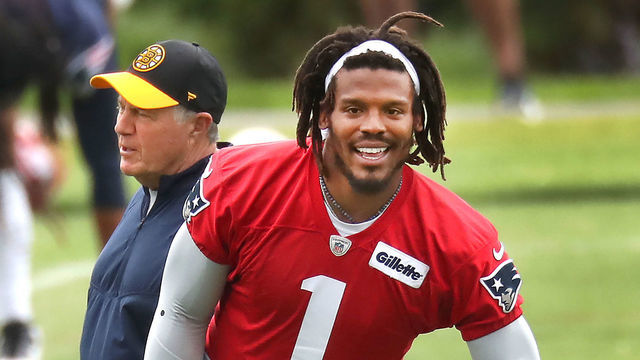 Foxborough, MA - June 4: Quarterback Cam Newton warms up as coach Bill Belichick walks by. The New England Patriots held OTAs (Organized Team Activities) at their practice field at Gillette Stadium in Foxborough, MA on June 4, 2021.
