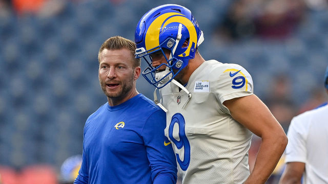 DENVER, COLORADO - AUGUST 28: Matthew Stafford #9 of the Los Angeles Rams walks off the field with head coach Sean McVay as players warm up before a game against the Denver Broncos at Empower Field at Mile High on August 28, 2021 in Denver, Colorado.