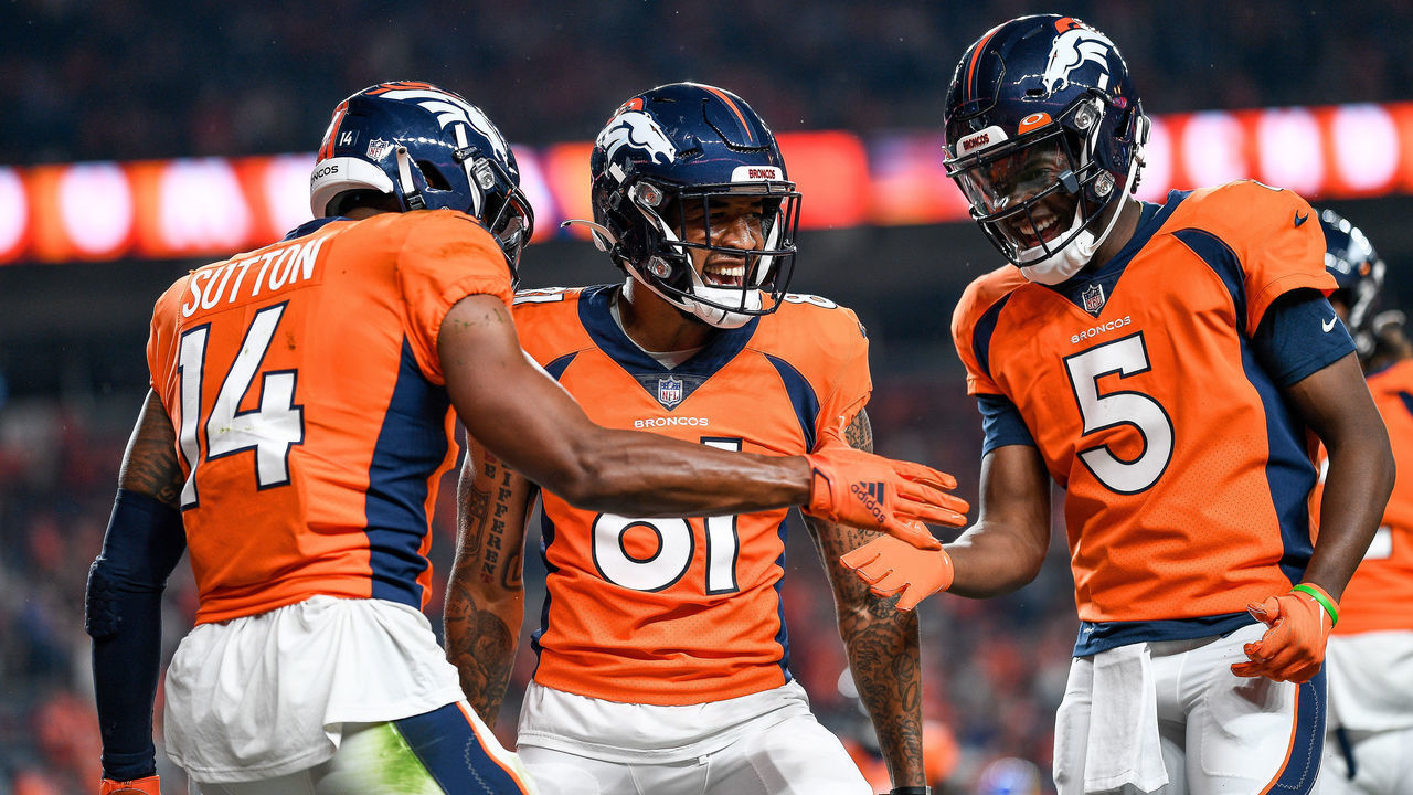 DENVER, COLORADO - AUGUST 28: Courtland Sutton #14 of the Denver Broncos celebrates with Teddy Bridgewater #5 and Tim Patrick #81 after a second quarter touchdown against the Los Angeles Rams at Empower Field at Mile High on August 28, 2021 in Denver, Colorado.
