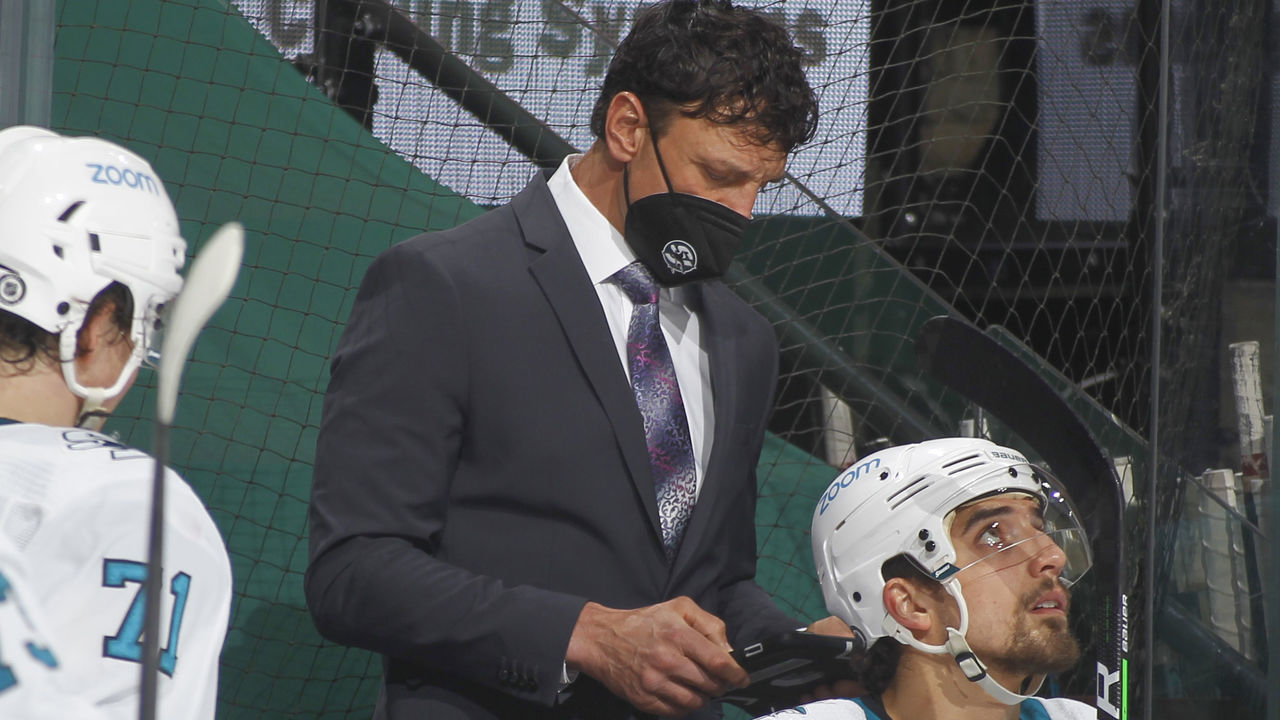 SAINT PAUL, MN - APRIL 17: San Jose Sharks assistant coach Rocky Thompson uses and iPad during the game against the Minnesota Wild at the Xcel Energy Center on April 17, 2021 in Saint Paul, Minnesota.