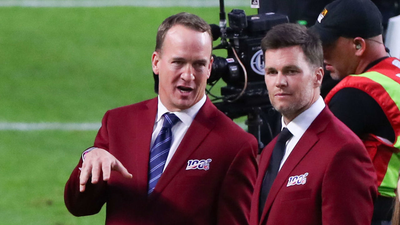 MIAMI GARDENS, FL - FEBRUARY 02: Tom Brady and Peyton Manning talk on the field during the 100 year team celebration prior to Super Bowl LIV on February 2, 2020 at Hard Rock Stadium in Miami Gardens, FL.