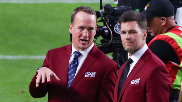 MIAMI GARDENS, FL - FEBRUARY 02: Tom Brady and Peyton Manning talk on the field during the 100 year team celebration prior to Super Bowl LIV on February 2, 2020 at Hard Rock Stadium in Miami Gardens, FL.