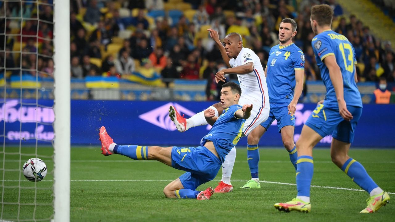 France's forward Anthony Martial (2L) shoots and scores his team's first goal during the FIFA World Cup Qatar 2022 Group D qualification football match between Ukraine and France at the Olympic Stadium in Kiev on September 4, 2021.