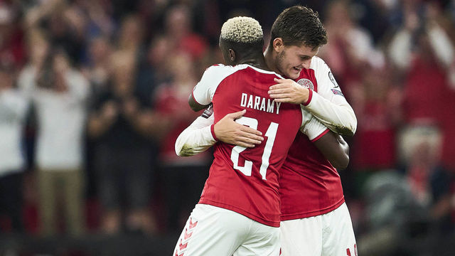COPENHAGEN, DENMARK - SEPTEMBER 01: Mohamed Daramy and Jonas Wind of Denmark celebrate after the FIFA World Cup 2022 Qualifier match between Denmark and Scotland at Parken on September 1, 2021 in Copenhagen, Denmark.