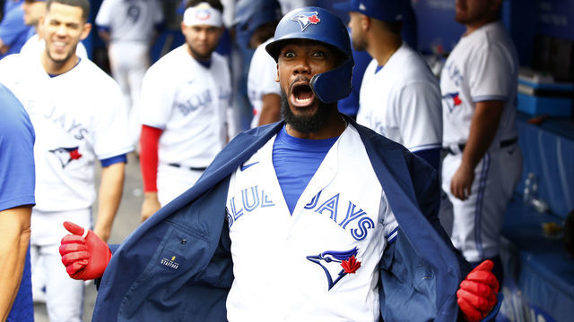 TORONTO, ON - SEPTEMBER 04: Teoscar Hernandez #37 of the Toronto Blue Jays celebrates with the Blue Jays home run jacket after hitting a three-run home run in the seventh inning during a MLB game against the Oakland Athletics at Rogers Centre on September 4, 2021 in Toronto, Ontario, Canada. This was the 100th home run of his career.