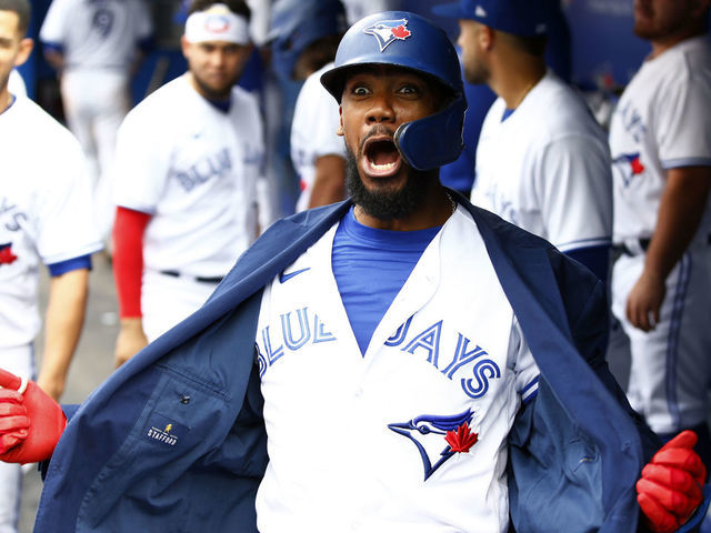 TORONTO, ON - SEPTEMBER 04: Teoscar Hernandez #37 of the Toronto Blue Jays celebrates with the Blue Jays home run jacket after hitting a three-run home run in the seventh inning during a MLB game against the Oakland Athletics at Rogers Centre on September 4, 2021 in Toronto, Ontario, Canada. This was the 100th home run of his career.