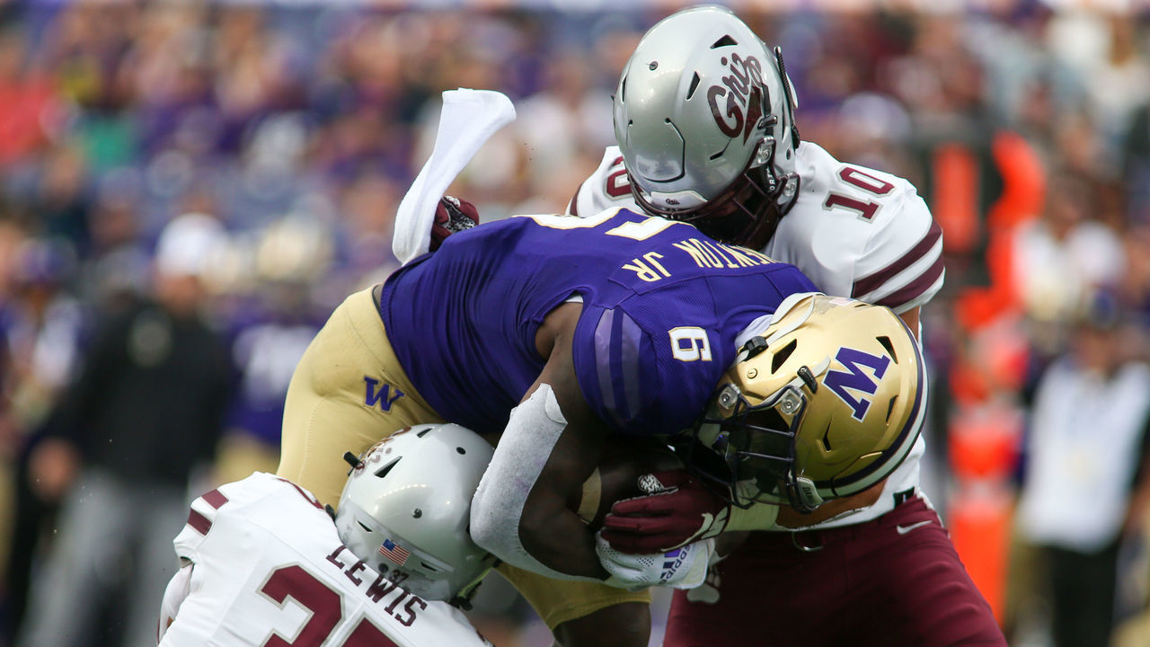 SEATTLE, WA - SEPTEMBER 04: Montana Grizzlies linebacker Marcus Welnel (10) and Montana Grizzlies linebacker Jace Lewis (37) tackles Washington Huskies running back Richard Newton (6) during a college football game between the Montana Grizzlies and the Washington Huskies on September 04, 2021, at Husky Stadium in Seattle, WA.