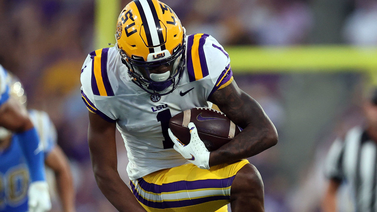 PASADENA, CALIFORNIA - SEPTEMBER 04: Kayshon Boutte #1 of the LSU Tigers runs the ball against Jay Shaw #1 of the UCLA Bruins in the second quarter at Rose Bowl on September 04, 2021 in Pasadena, California.