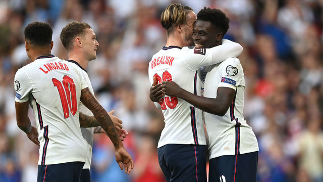 LONDON, ENGLAND - SEPTEMBER 05: Bukayo Saka of England celebrates with Jack Grealish after scoring their team's fourth goal during the 2022 FIFA World Cup Qualifier match between England and Andorra at Wembley Stadium on September 05, 2021 in London, England.