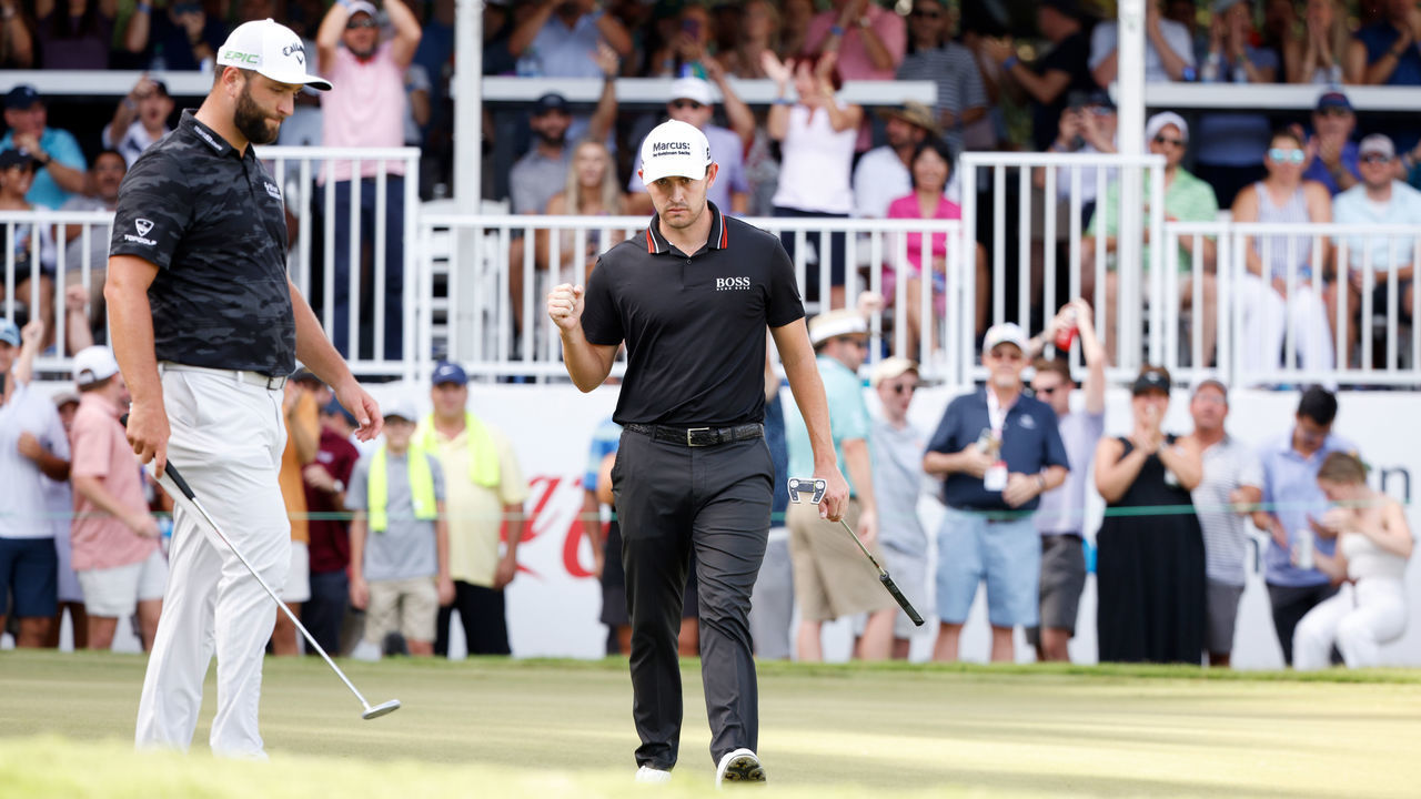 ATLANTA, GEORGIA - SEPTEMBER 04: Patrick Cantlay of the United States reacts on the ninth green as Jon Rahm of Spain looks on during the third round of the TOUR Championship at East Lake Golf Club on September 04, 2021 in Atlanta, Georgia.