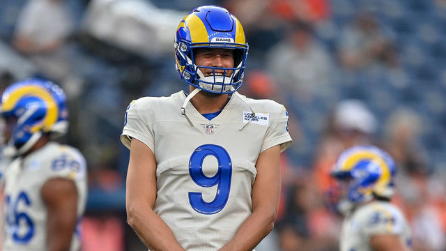 DENVER, COLORADO - AUGUST 28: Matthew Stafford #9 of the Los Angeles Rams looks on as players warm up before a game against the Denver Broncos at Empower Field at Mile High on August 28, 2021 in Denver, Colorado.