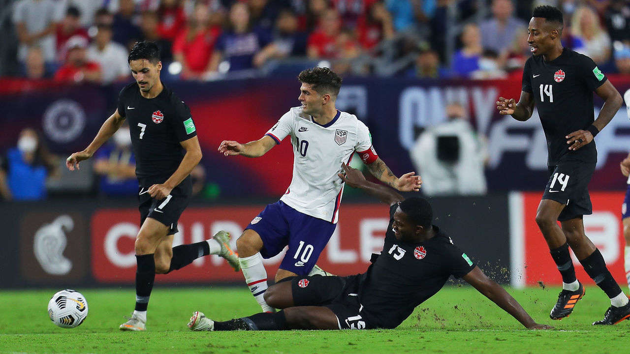 NASHVILLE, TN - SEPTEMBER 05: Christian Pullisic #10 of United States and Doneil Henry #15 of Canada fight for the ball during the FIFA World Cup Qatar 2022 qualifiers match between United States and Canada at Nissan Stadium on September 5, 2021 in Nashville, Tennessee.