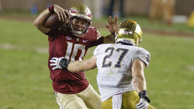 TALLAHASSEE, FL - SEPTEMBER 05: Florida State Seminoles quarterback McKenzie Milton (10) eludes a tackle attempt by Notre Dame Fighting Irish linebacker JD Bertrand (27) during the game between the Notre Dame Fighting Irish and the Florida State Seminoles on September 5, 2021 at Bobby Bowden Field at Doak Campbell Stadium in Tallahassee, Fl.
